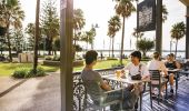 Friends enjoying afternoon drinks at The Beach House Restaurant and Bar in Port Macquarie, North Coast