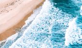 Aerial overlooking the scenic coastline and beaches near Lake Macquarie.