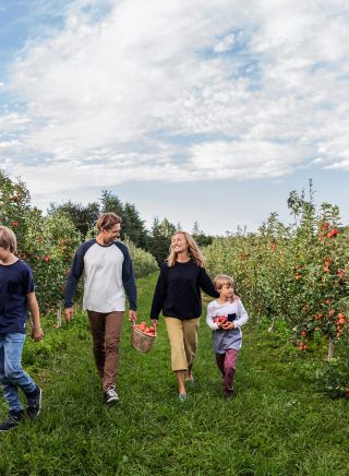 Family enjoying a day of apple picking at Shields Orchard, Bilpin