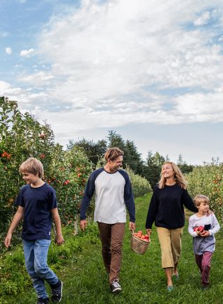 Family enjoying a day of apple picking at Shields Orchard, Bilpin