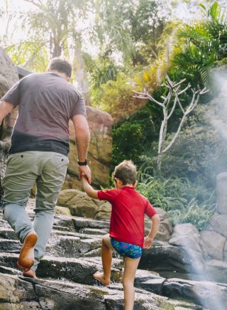 Father and son enjoying the Shipwreck Island Waterpark at BIG4 NRMA South West Rocks Holiday Park, South West Rocks