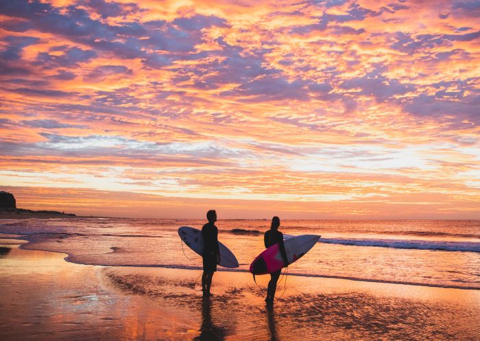 Nobbys Beach, Newcastle Surfing at sunrise at Nobbys Beach, Newcastle