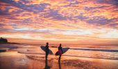 Surfing at sunrise at Nobbys Beach, Newcastle