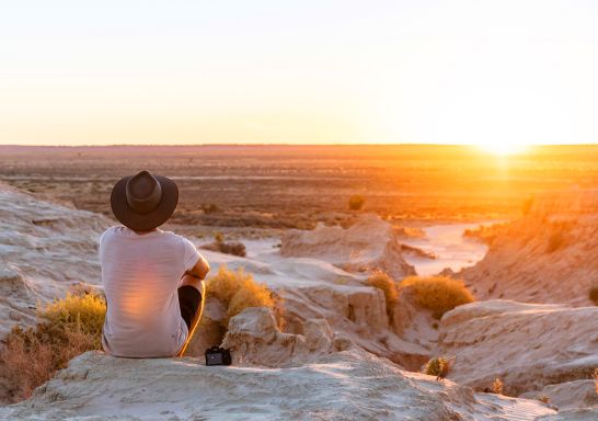 Man watching the sunset at the Walls of China in Mungo National Park - Mungo - Outback NSW