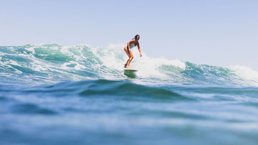 Surfer riding a wave, Bilgola Beach
