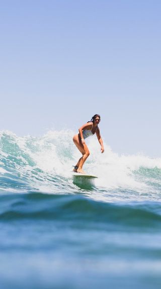 Surfer riding a wave, Bilgola Beach