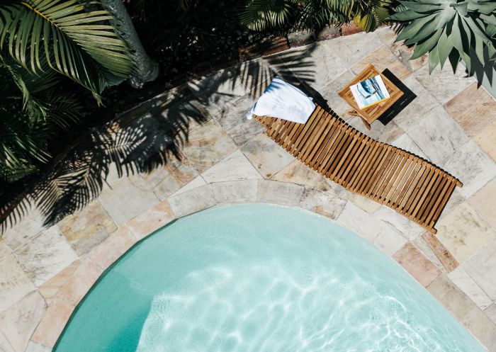 Cape Byron, Byron Bay - Credit: Cape Byron Outdoor pool and chair at Cape Byron, Byron Bay