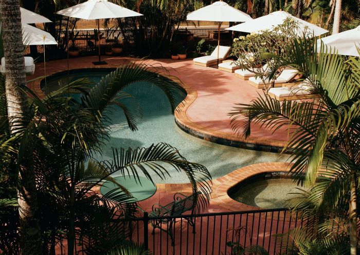 Credit: James Tolic Swimming pool with sun loungers at The Sunseeker, Byron Bay