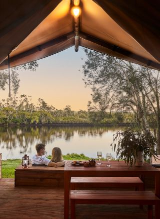 Couple enjoying Myall River Camp, Hawks Nest