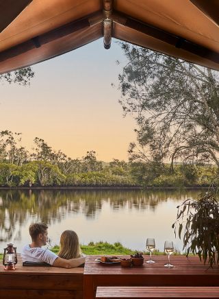 Couple enjoying Myall River Camp, Hawks Nest