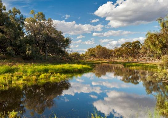 Clouds reflect off a creek in Willandra National Park, near Hillston